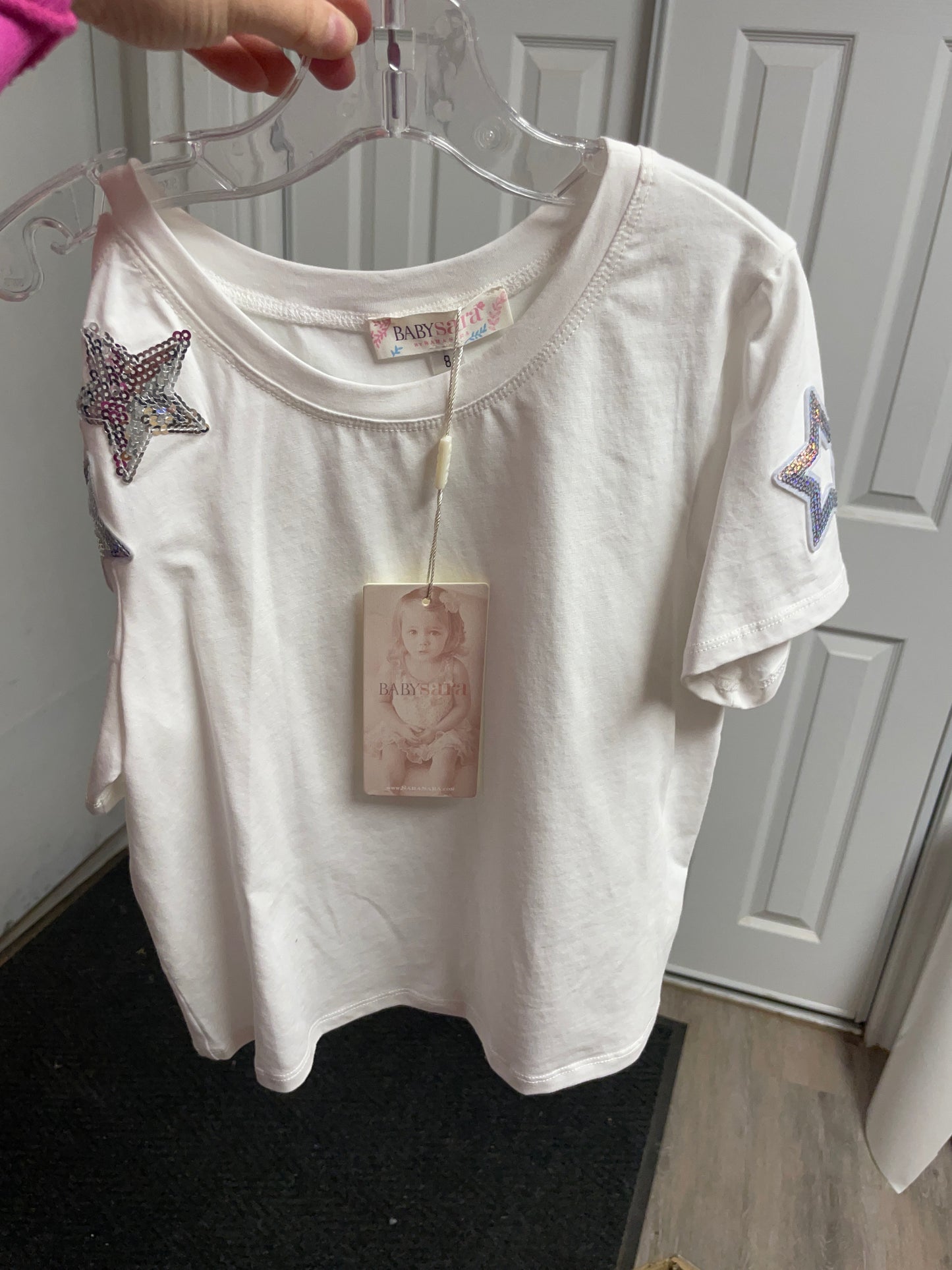 S/S TOP WITH SHOULDER AND STAR TRIM DETAILS