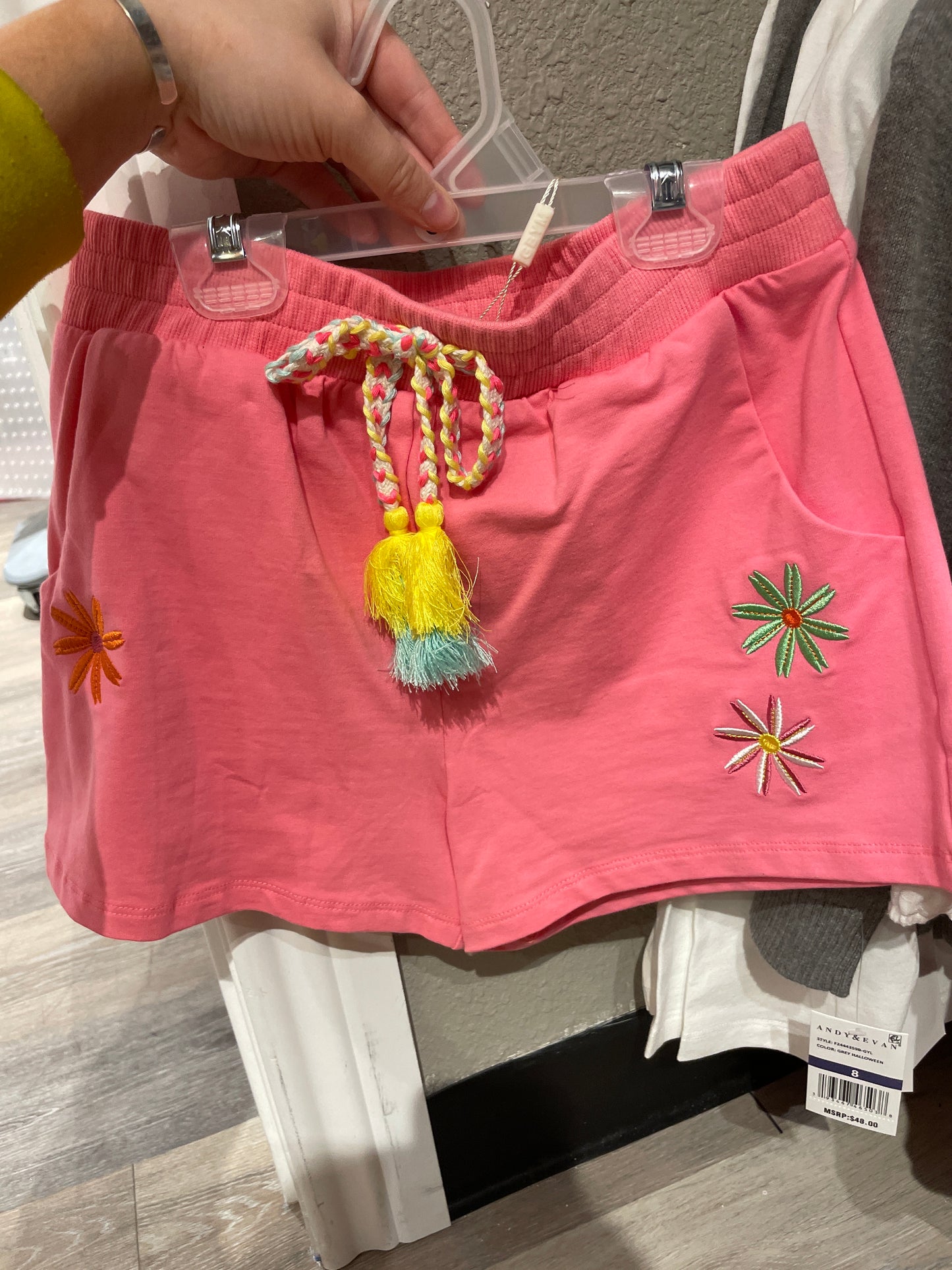 SHORTS WITH FLOWER TRIM AND TASSEL TIE