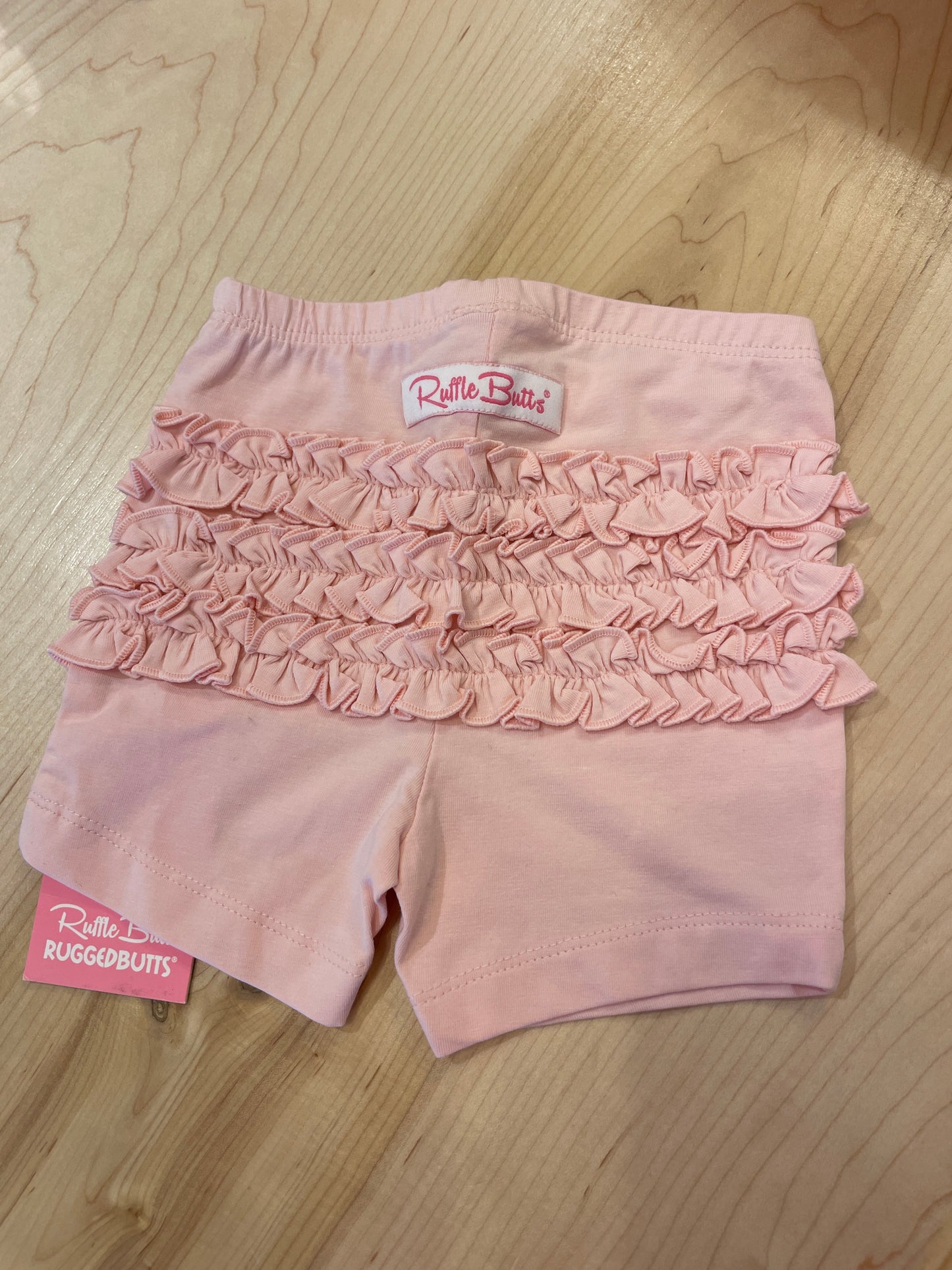 PINK RUFFLE PLAYGROUND SHORT
