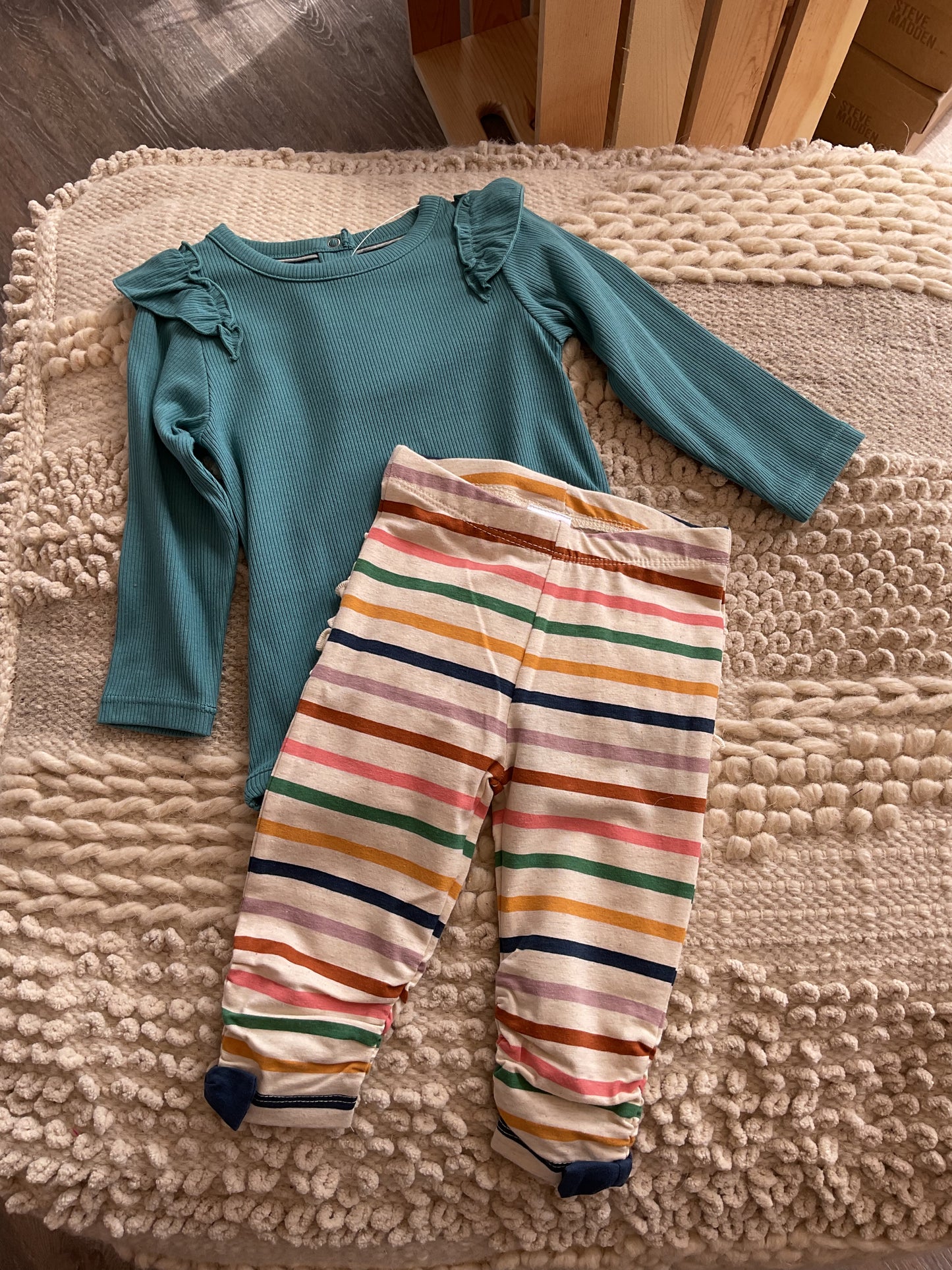 BRITTANY BLUE RIB KNIT LONG SLEEVE FLUTTER BODYSUIT